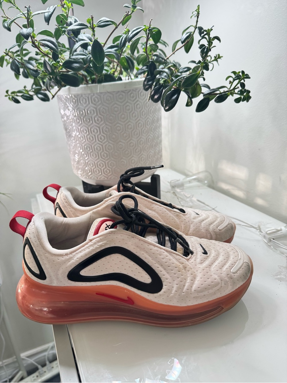 Nike Air Max beige sneakers with coral-tinted translucent midsole and black logo